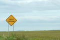 Warning sign turtle crossing along the road Royalty Free Stock Photo