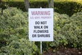 Warning Sign. US Goverment Property Warning Sign. Do not walk on Flowers or Shrubs Royalty Free Stock Photo