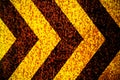 Warning danger sign yellow and black stripes as arrows painted over rusty metal plate as texture background. Royalty Free Stock Photo