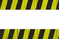 Warning sign yellow and black stripes painted over cracked wood as border frame Royalty Free Stock Photo