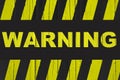Warning sign with yellow and black stripes painted over cracked wood