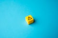 Warning sign on yellow block. Stress, problems. Something wrong. Danger or problem ahead. Careful proceed with caution. Workplace Royalty Free Stock Photo