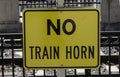 Warning signage for No Train Horn at a railway station Royalty Free Stock Photo