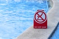 Warning signs, do not jump into this area of the pool.