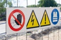 Warning signs on fence at construction site Royalty Free Stock Photo