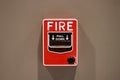 Fire alarm button The red square box style Attached to the wall of the brown room, a warning sign in the event of fire For the saf Royalty Free Stock Photo