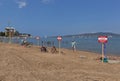 Warning signs with the inscription Warning! No swimming! Danger to life on the beach in Gelendzhik