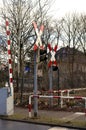 Warning signs and lamps with barrier at railroad crossing Royalty Free Stock Photo