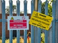 Warning signs on the Leeds to Liverpool Canal in Lancashire, UK - the signs prohibit fishing due to overhead power lines