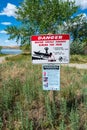 Warning signs at the Ringold Boat Launch in the Saddle Mountain National Wildlife Refuge in Washington, USA - May 7, 2021