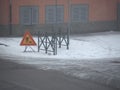 road works sign in the snow