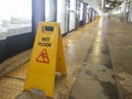 The warning signs wet floor on the sky train station to remind people to walk safely Royalty Free Stock Photo