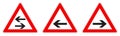 Warning - single/two way traffic sign. Black arrow in red triangle, version with arrow pointing left, right and both ways Royalty Free Stock Photo