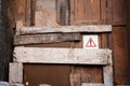 Warning symbol on old wooden door Royalty Free Stock Photo