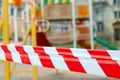 Warning tape on empty closed blurred playground background Royalty Free Stock Photo