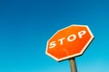 Stop signal in a sunny day. Royalty Free Stock Photo