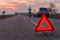 Warning triangle sign on the road