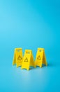 Warning yellow clamshell floor signs. Identify dangers and threats