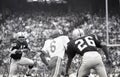 Warren McVea #6 is tackled by Dave Grayson #45