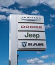 Warren, Pennsylvania, USA August 14, 2022 A silver sign for Chrysler, Dodge, Jeep and Ram at a dealership