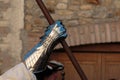 Warrior with Medieval Metallic Mitten for Hands Protection and Wooden Stick