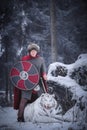 Warrior stands over a growling white tiger Royalty Free Stock Photo