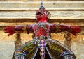Warrior statue with mozaic costume, grand palace, heart of Bangkok, Thailand.