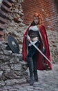 Warrior woman with sword in medieval clothes is very dangerous Royalty Free Stock Photo