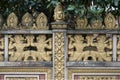 Warriors statues decorated wall of a Khmer Buddhist temple in Ho Chi Minh City, Vietnam Royalty Free Stock Photo