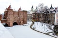 Warsaw Barbacan fortress castle in winter is in the capital city of Poland. Old town is the historic center of Warsaw Royalty Free Stock Photo