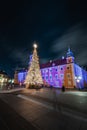 20.12.2021 - Warsaw. A Christmas tree with a huge star on top in the castle square in front of the Royal Castle, which is