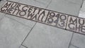 Warsaw Ghetto Wall historical location sign on the floor- July 6th, 2015 - Warsaw, Poland