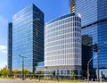 Warsaw Hub office complex of Ghelamco at Rondo Daszynskiego roundabout with Skyliner Tower construction site in background in Wola