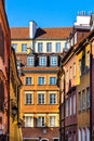 Warsaw, Mazovia / Poland - 2020/05/10: Colorful tenement houses of historic Old Town quarter - Stare Miasto - along Krzywe Kolo Royalty Free Stock Photo