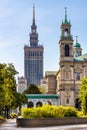 Srodmiescie district with Culture and Science Palace PKiN tower and All Saints church at Grzybowski square in Warsaw, Poland