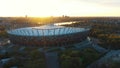 Warsaw national stadium on beautiful golden sunrise. Aerial establishing shot