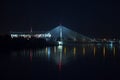 Warsaw by night bridge Swietokrzyski National Stadium and the Vistula river