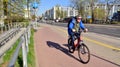 Warsaw, Poland. 21 April 2023. Lonely cyclist on the urban bike path in the city