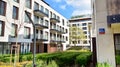 Modern apartment building in Srodmiescie district on a sunny day with a blue sky. Facade of a modern apartment.