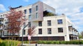 Modern apartment building in Srodmiescie district on a sunny day with a blue sky. Facade of a modern apartment.