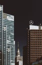 Warsaw, Poland - August 8th, 2021: Skyscaper with Mercedes-Benz logo near Palace of Science and Culture iconic building in Warsaw Royalty Free Stock Photo