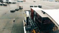 WARSAW, POLAND - DECEMBER 27, 2019. Loading Emirates Airlines baggage at the airport