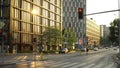 Empty Domaniewska street in Warsaw, Poland. Red signal light and golden sun refflection on the buildings Royalty Free Stock Photo