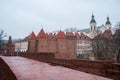 Warsaw, Poland Famous Barbican old town historic capital city during rainy winter day and red orange brick wall fortress Royalty Free Stock Photo