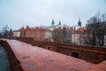 Warsaw, Poland Famous Barbican old town historic capital city during rainy winter day and red orange brick wall fortress Royalty Free Stock Photo