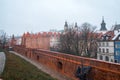 Warsaw, Poland Famous Barbican old town historic capital city during rainy winter day and red orange brick wall fortress Royalty Free Stock Photo