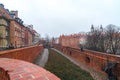 Warsaw, Poland Famous Barbican old town historic capital city during rainy winter day and red orange brick wall fortress Royalty Free Stock Photo