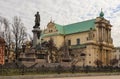 Warsaw, Poland - February 27 2019: Adam Mickiewicz monument and Church of Saint Joseph at the center of the city