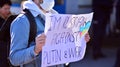 Anti-war protest outside Russian embassy in Warsaw. Demonstrators call for peace and condemn Putin.