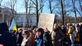 Anti-war protest outside Russian embassy in Warsaw. Demonstrators call for peace and condemn Putin.